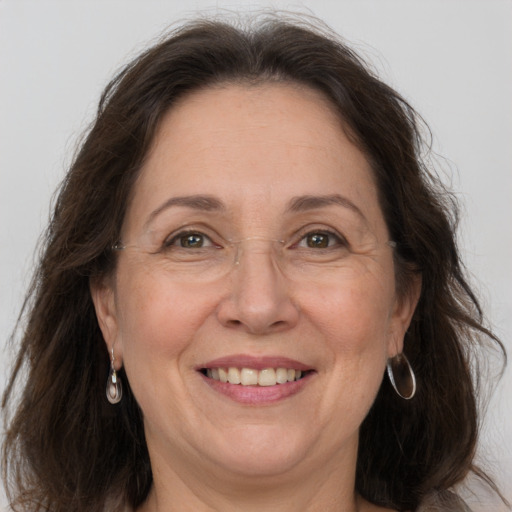 Joyful white adult female with medium  brown hair and grey eyes