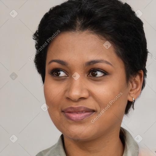 Joyful black young-adult female with short  brown hair and brown eyes