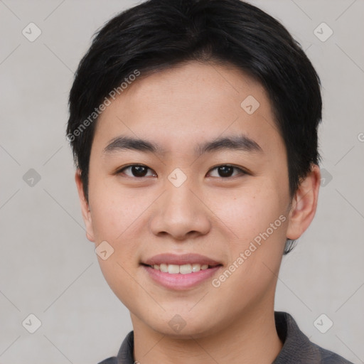 Joyful asian young-adult male with short  black hair and brown eyes