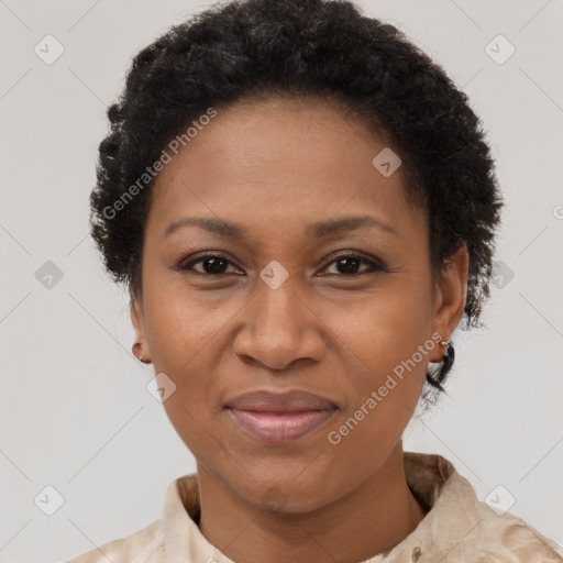 Joyful black adult female with short  brown hair and brown eyes