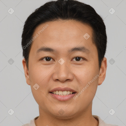 Joyful asian young-adult male with short  brown hair and brown eyes