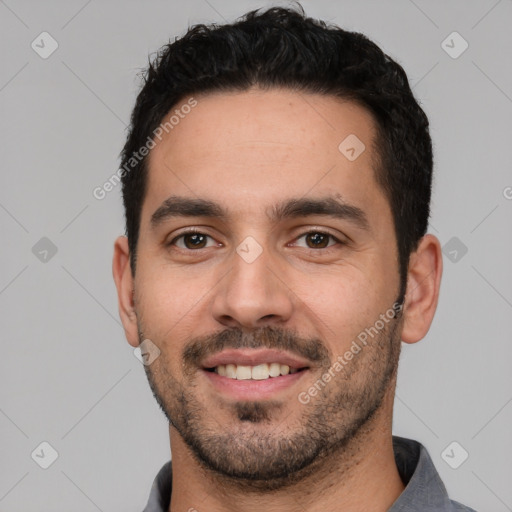 Joyful white young-adult male with short  black hair and brown eyes