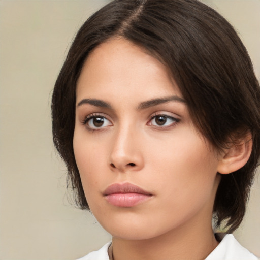 Neutral white young-adult female with medium  brown hair and brown eyes