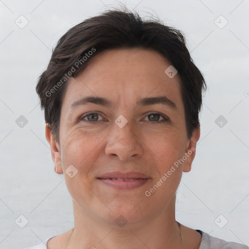 Joyful white adult female with short  brown hair and brown eyes