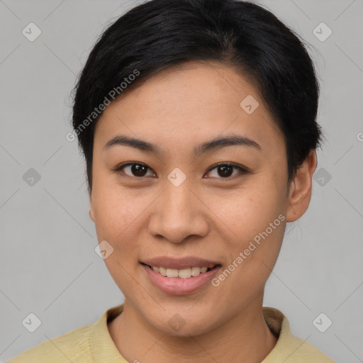 Joyful asian young-adult female with short  brown hair and brown eyes