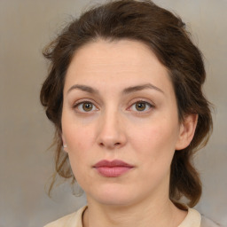 Neutral white young-adult female with medium  brown hair and green eyes