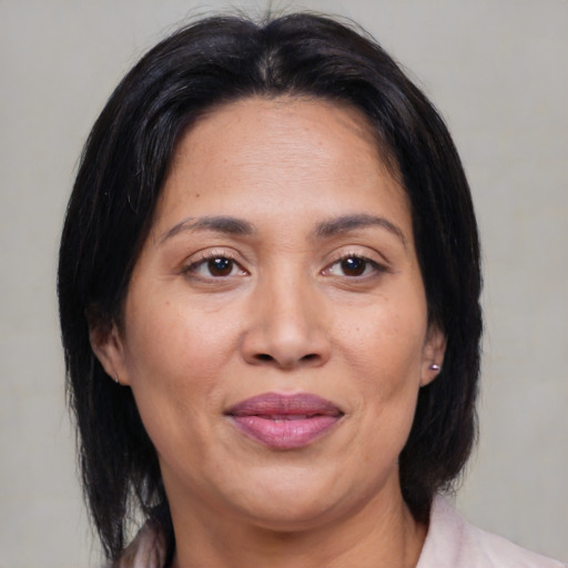 Joyful asian adult female with medium  brown hair and brown eyes
