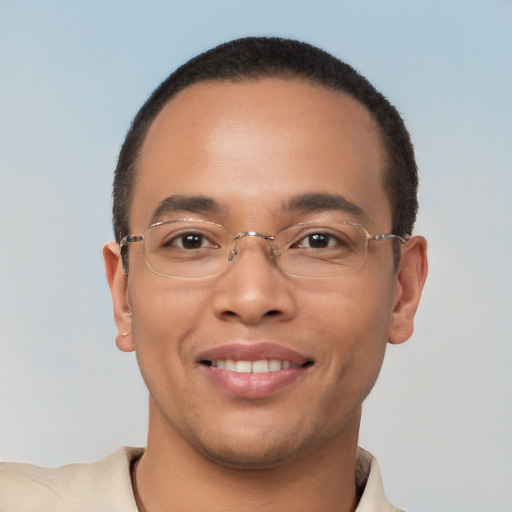 Joyful latino young-adult male with short  brown hair and brown eyes