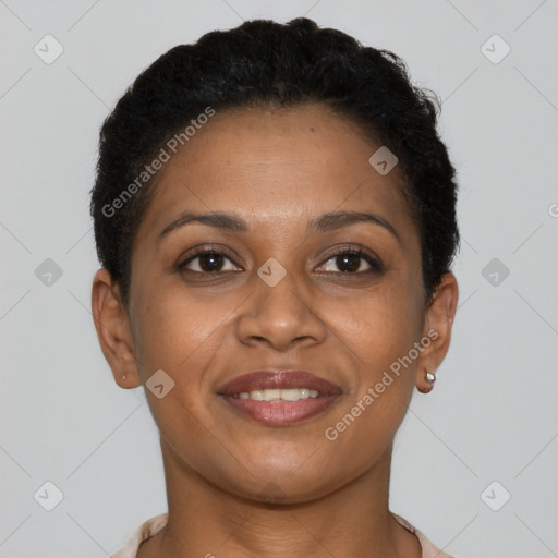 Joyful black young-adult female with short  brown hair and brown eyes