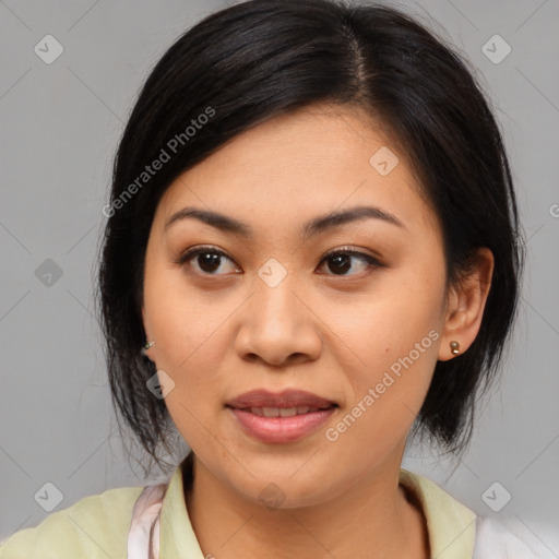 Joyful asian young-adult female with medium  black hair and brown eyes