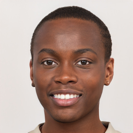 Joyful black young-adult male with short  brown hair and brown eyes