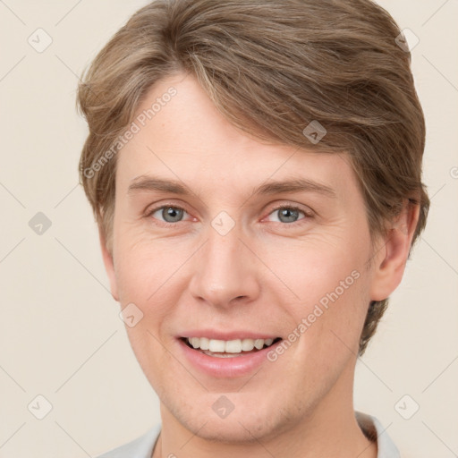 Joyful white adult male with short  brown hair and grey eyes