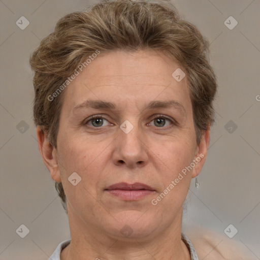 Joyful white adult female with short  brown hair and grey eyes