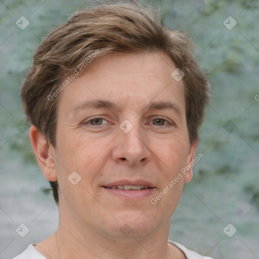 Joyful white adult male with short  brown hair and grey eyes