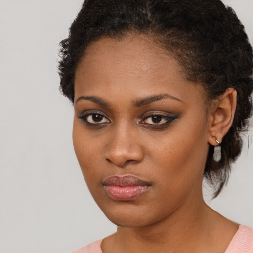 Neutral black young-adult female with medium  black hair and brown eyes