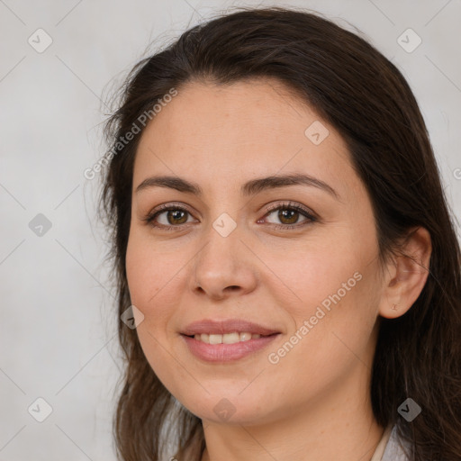 Joyful white young-adult female with long  brown hair and brown eyes