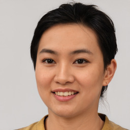 Joyful asian young-adult female with short  brown hair and brown eyes