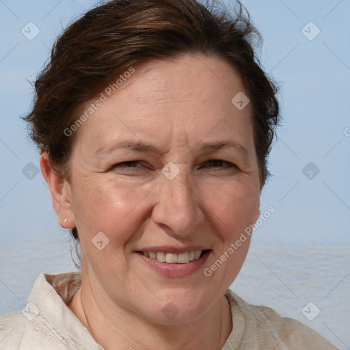 Joyful white adult female with short  brown hair and brown eyes