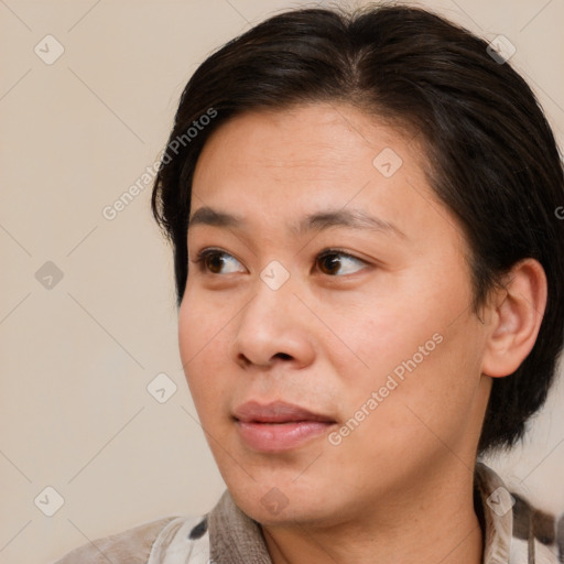 Joyful white adult female with medium  brown hair and brown eyes