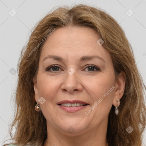 Joyful white adult female with long  brown hair and brown eyes