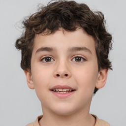 Joyful white child male with short  brown hair and brown eyes