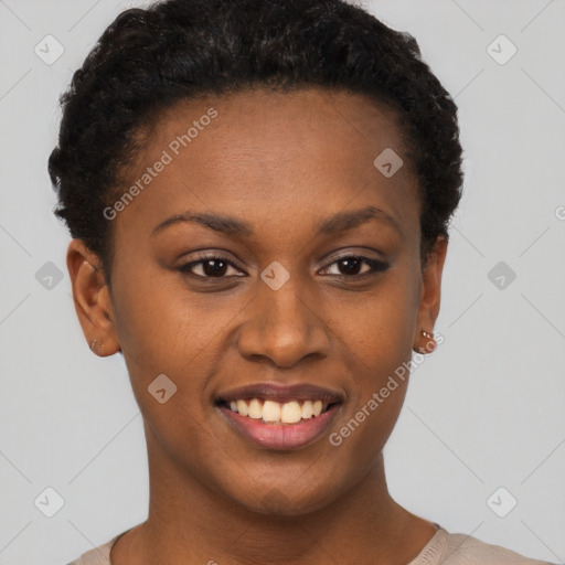 Joyful black young-adult female with short  brown hair and brown eyes