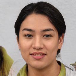 Joyful asian young-adult female with medium  black hair and brown eyes