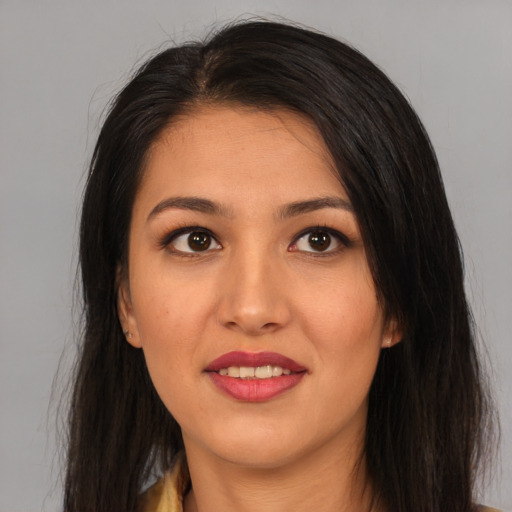 Joyful asian young-adult female with long  brown hair and brown eyes