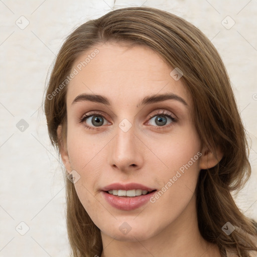 Joyful white young-adult female with long  brown hair and green eyes