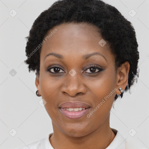 Joyful black adult female with short  brown hair and brown eyes