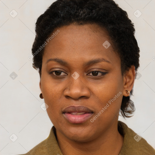 Joyful black adult female with short  black hair and brown eyes