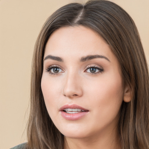 Neutral white young-adult female with long  brown hair and brown eyes