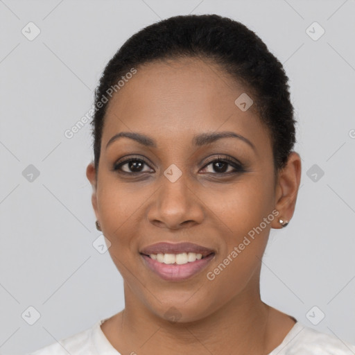 Joyful black young-adult female with short  black hair and brown eyes