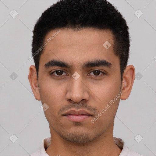 Neutral latino young-adult male with short  black hair and brown eyes