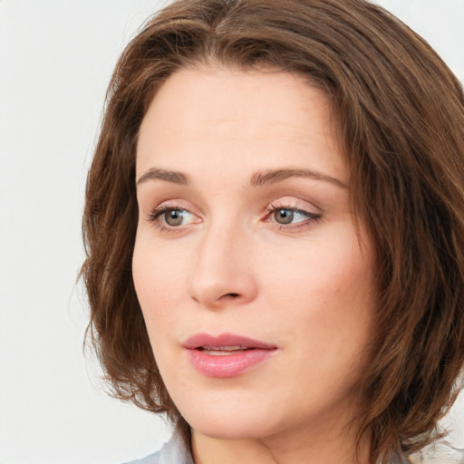 Neutral white young-adult female with medium  brown hair and green eyes