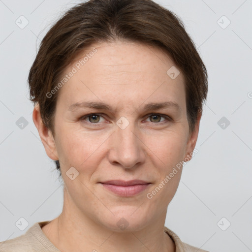 Joyful white adult female with short  brown hair and grey eyes