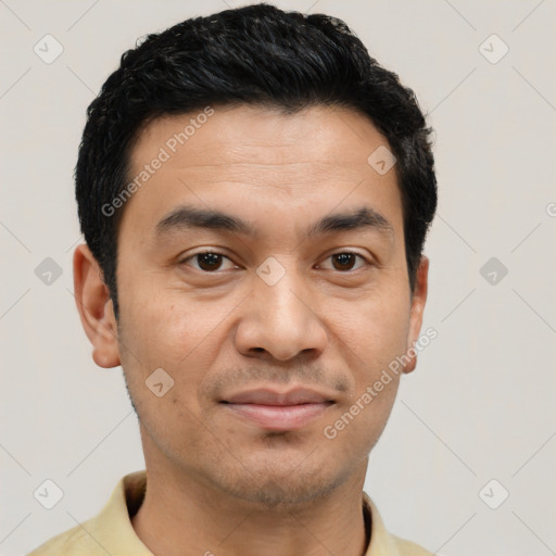 Joyful latino young-adult male with short  brown hair and brown eyes