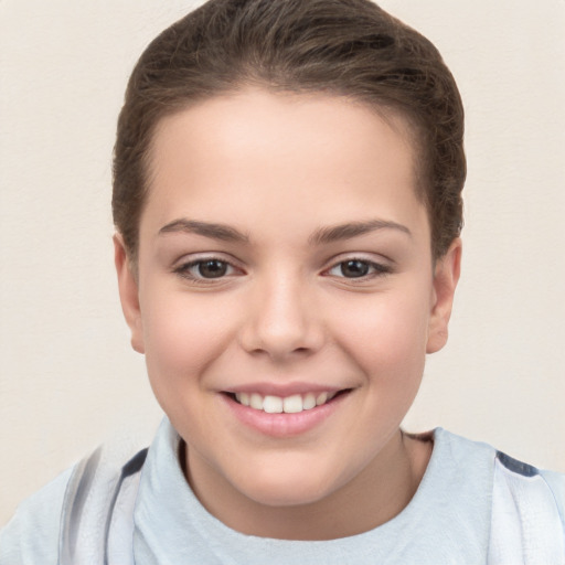 Joyful white child female with short  brown hair and brown eyes