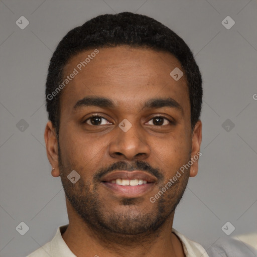 Joyful latino young-adult male with short  brown hair and brown eyes