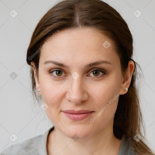 Joyful white young-adult female with medium  brown hair and grey eyes