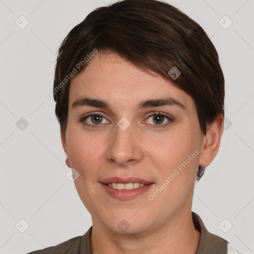 Joyful white young-adult female with short  brown hair and grey eyes