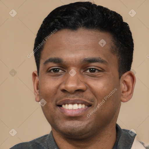 Joyful black young-adult male with short  black hair and brown eyes