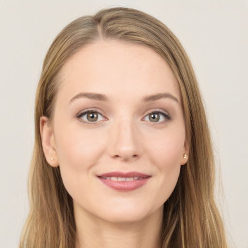 Joyful white young-adult female with long  brown hair and grey eyes