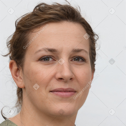 Joyful white adult female with short  brown hair and grey eyes