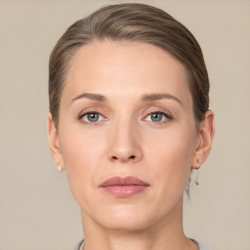 Joyful white adult female with short  brown hair and grey eyes