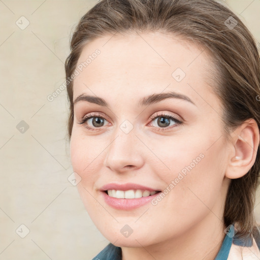 Joyful white young-adult female with medium  brown hair and blue eyes