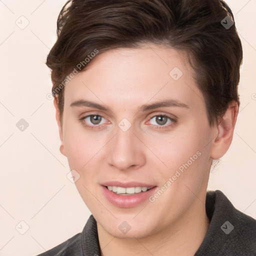 Joyful white young-adult female with short  brown hair and grey eyes