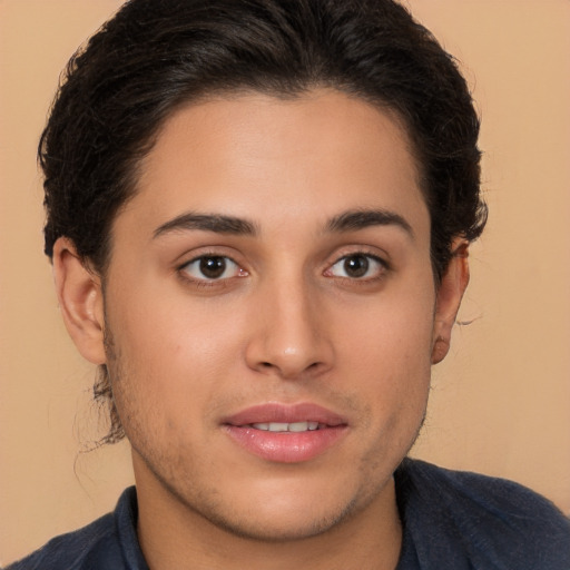 Joyful latino young-adult male with long  brown hair and brown eyes