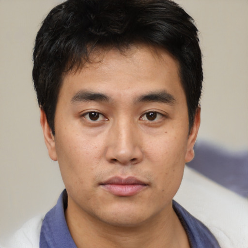 Neutral asian young-adult male with short  brown hair and brown eyes