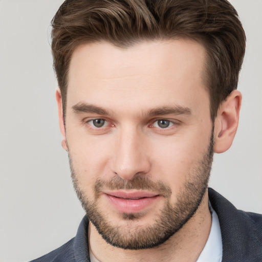 Joyful white young-adult male with short  brown hair and brown eyes